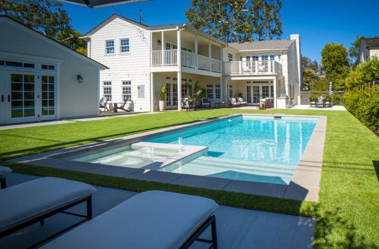 Luxury house with a swimming pool outside.
